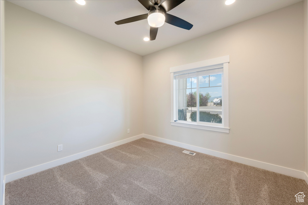 Unfurnished room featuring carpet floors, recessed lighting, and ceiling fan