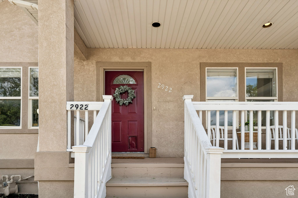 Doorway to property with stucco siding
