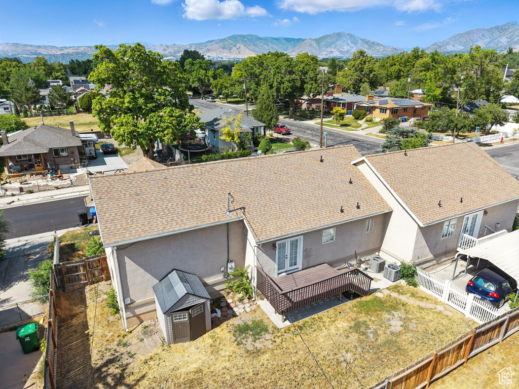 Aerial perspective of suburban area with a mountain backdrop