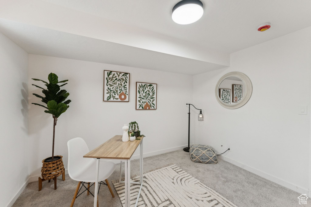 Carpeted office featuring baseboards