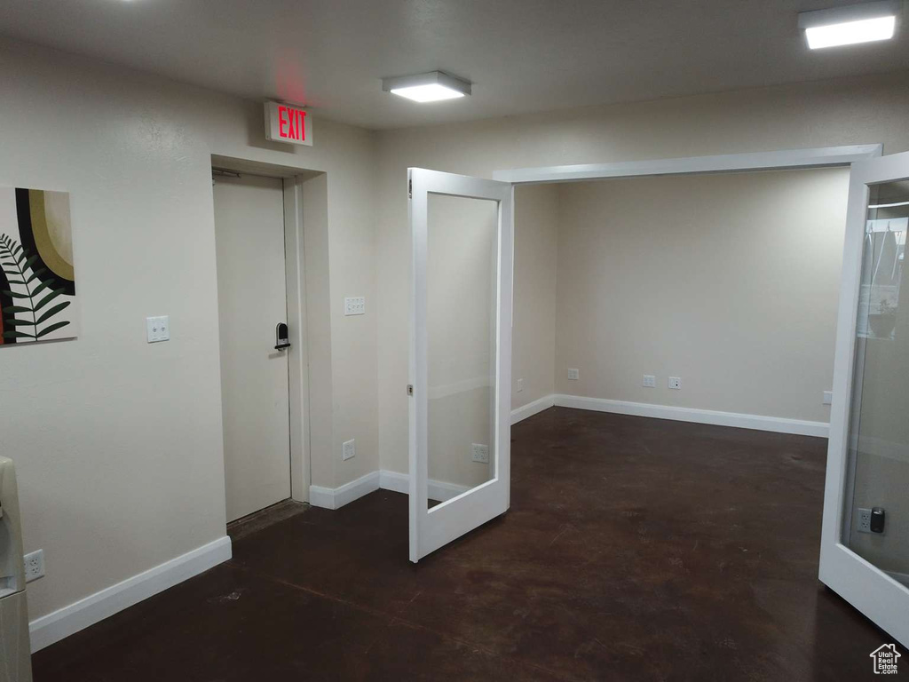 Unfurnished room with baseboards