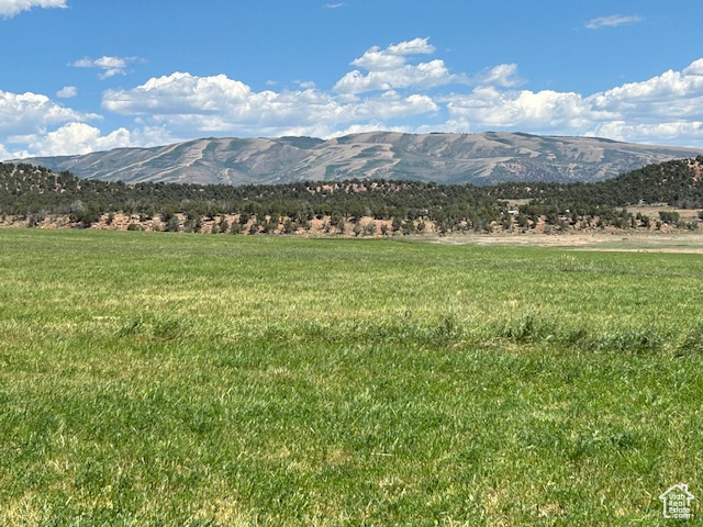 View of mountain backdrop with rural landscape