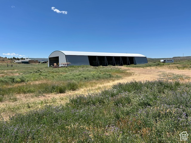View of pole building featuring a view of countryside