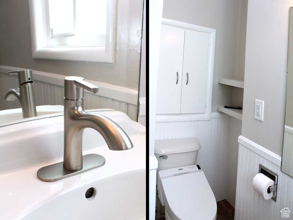 Half bath with wainscoting and toilet