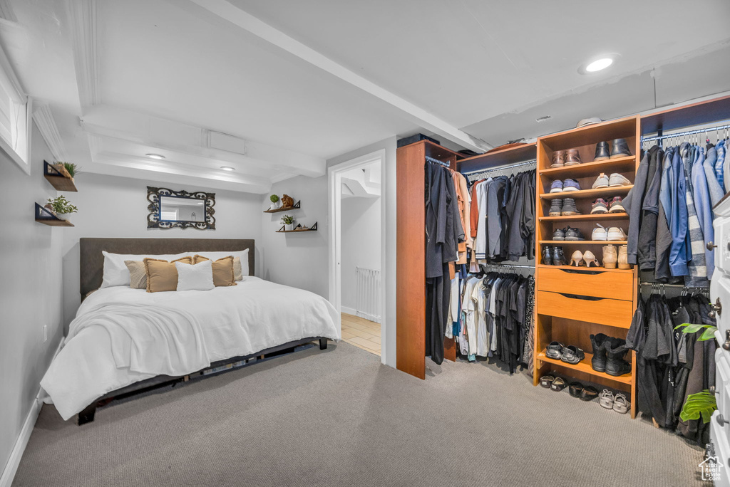Carpeted bedroom featuring recessed lighting and baseboards