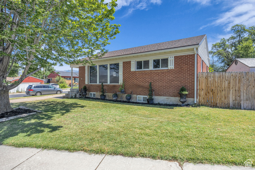 View of front of house with brick siding