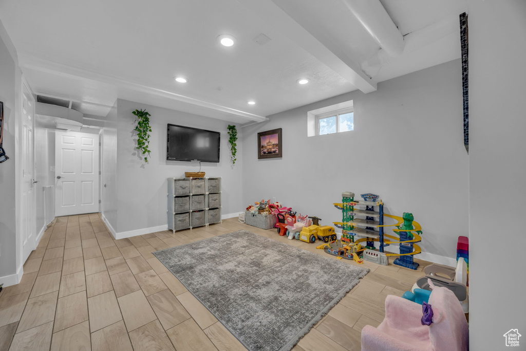 Recreation room featuring recessed lighting and wood finished floors