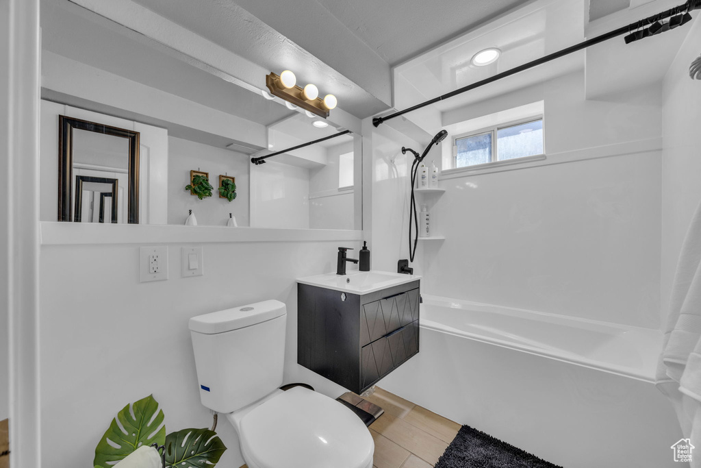 Bathroom featuring tub / shower combination and vanity