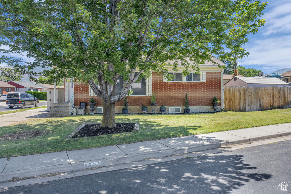 View of front of property featuring brick siding