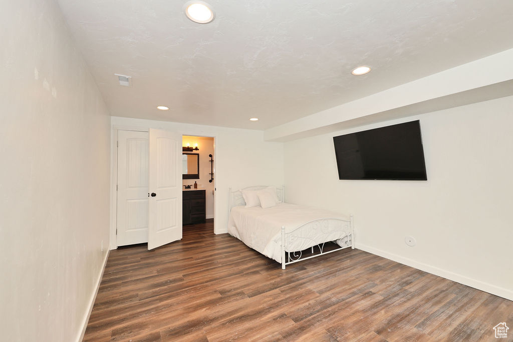 Bedroom featuring recessed lighting and wood finished floors
