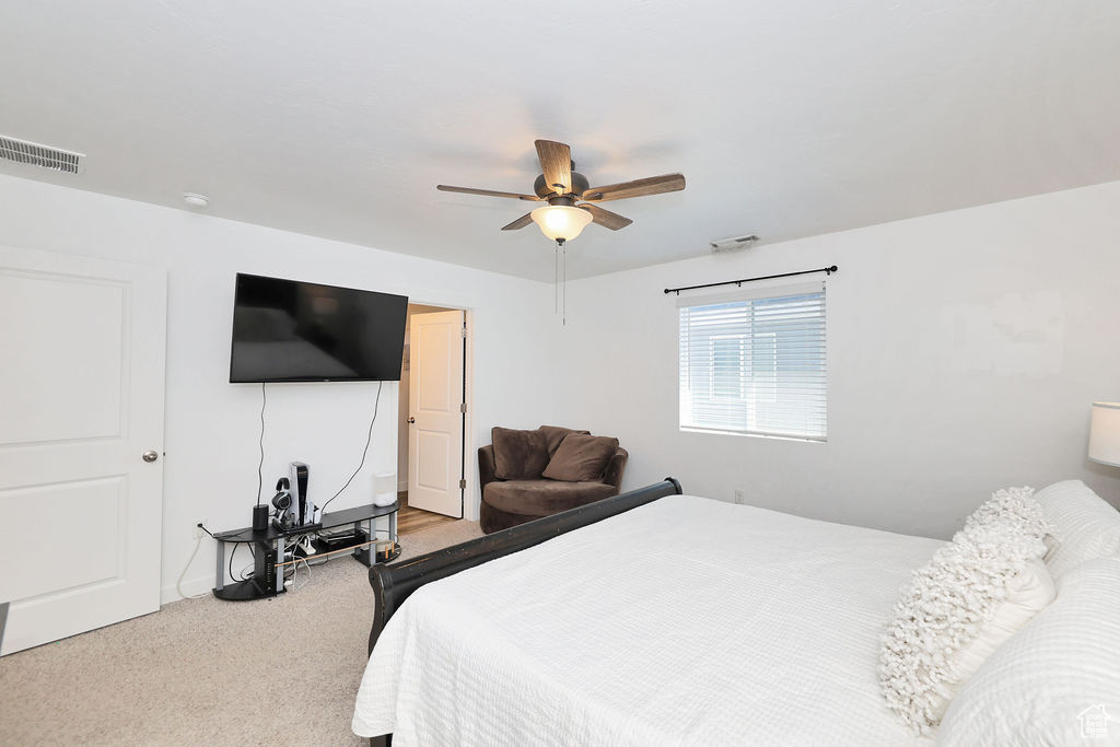 Bedroom featuring carpet and ceiling fan