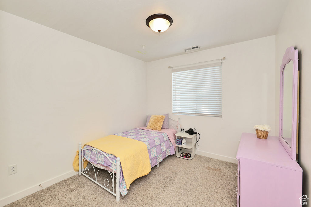 Bedroom with carpet flooring