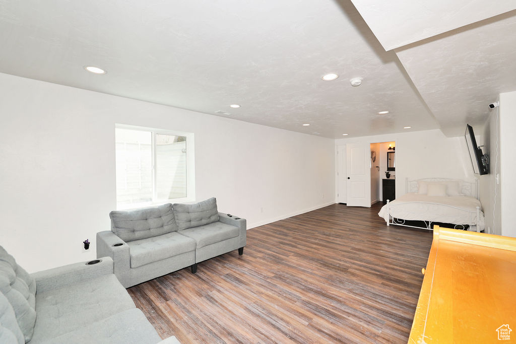 Living room featuring wood finished floors and recessed lighting