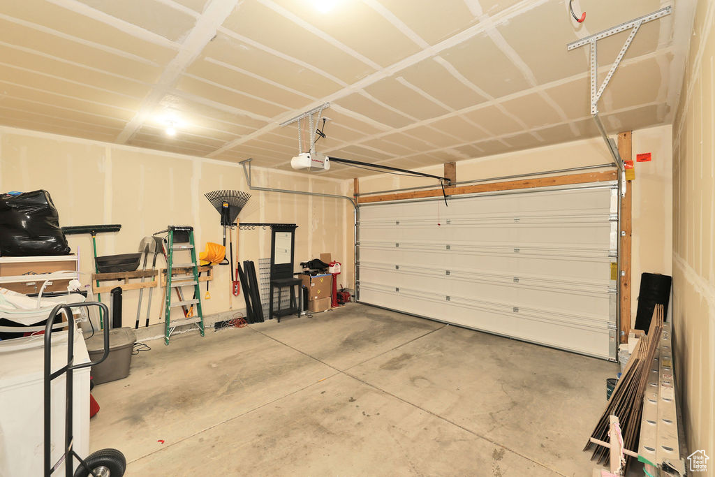 Garage featuring a garage door opener