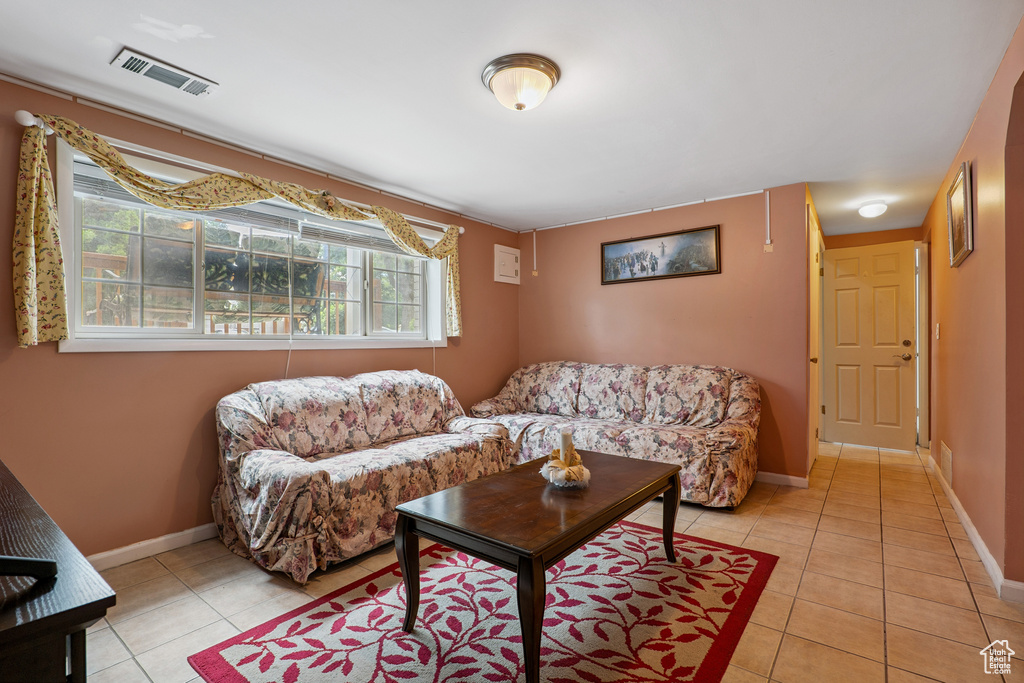 Living room with light tile patterned floors