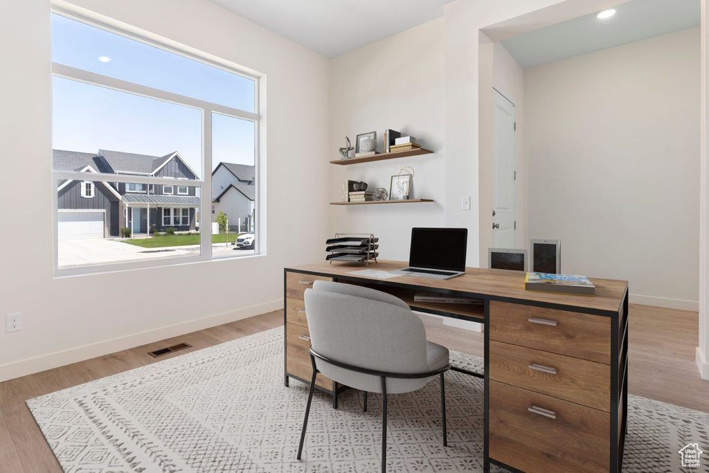 Office space featuring wood finished floors