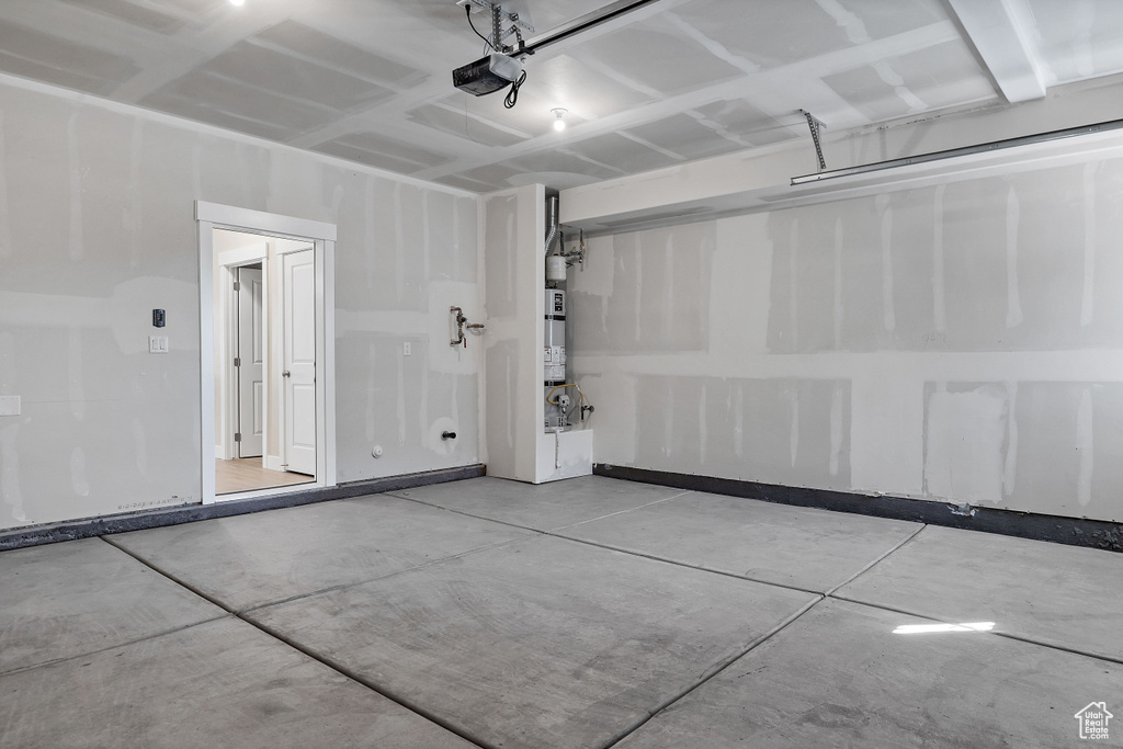 Garage featuring a garage door opener