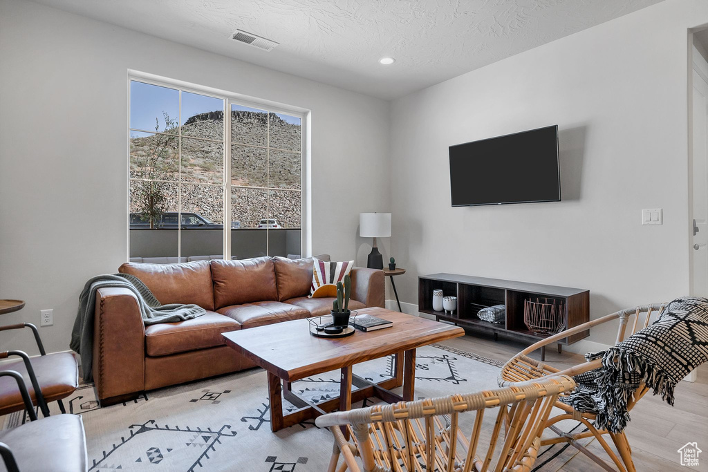 Living area featuring recessed lighting and light wood finished floors