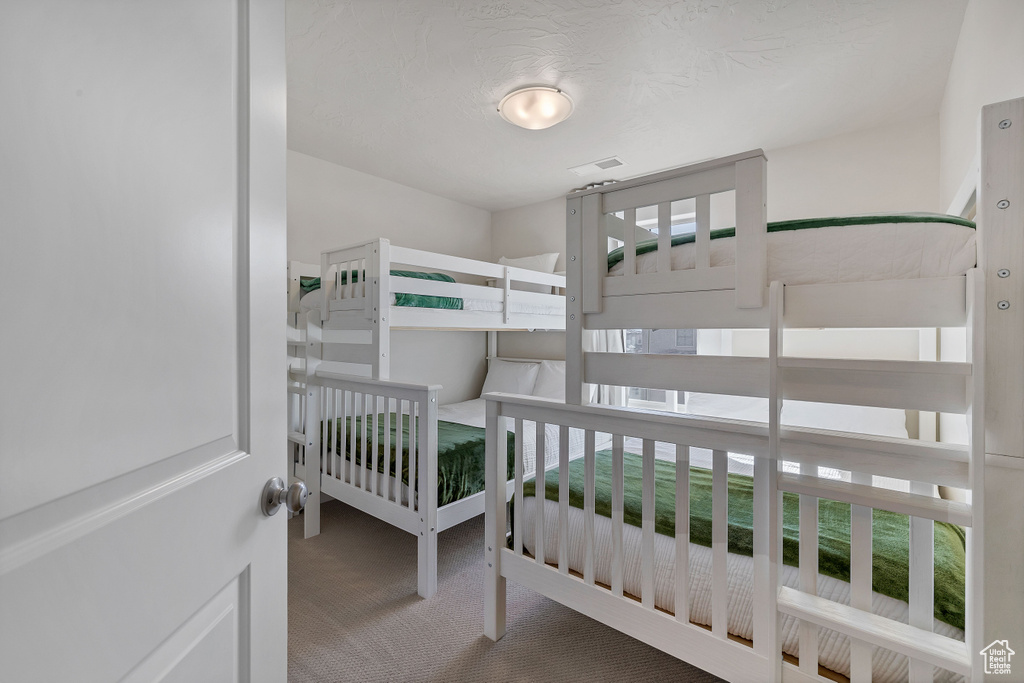 Unfurnished bedroom with carpet floors