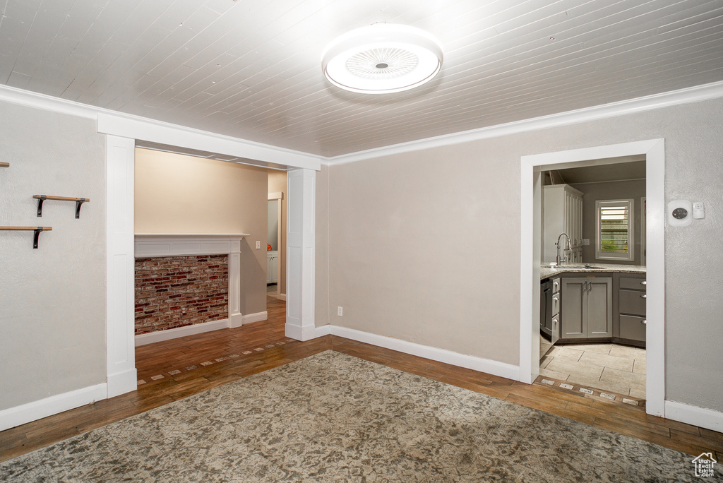 Empty room featuring wood finished floors and baseboards