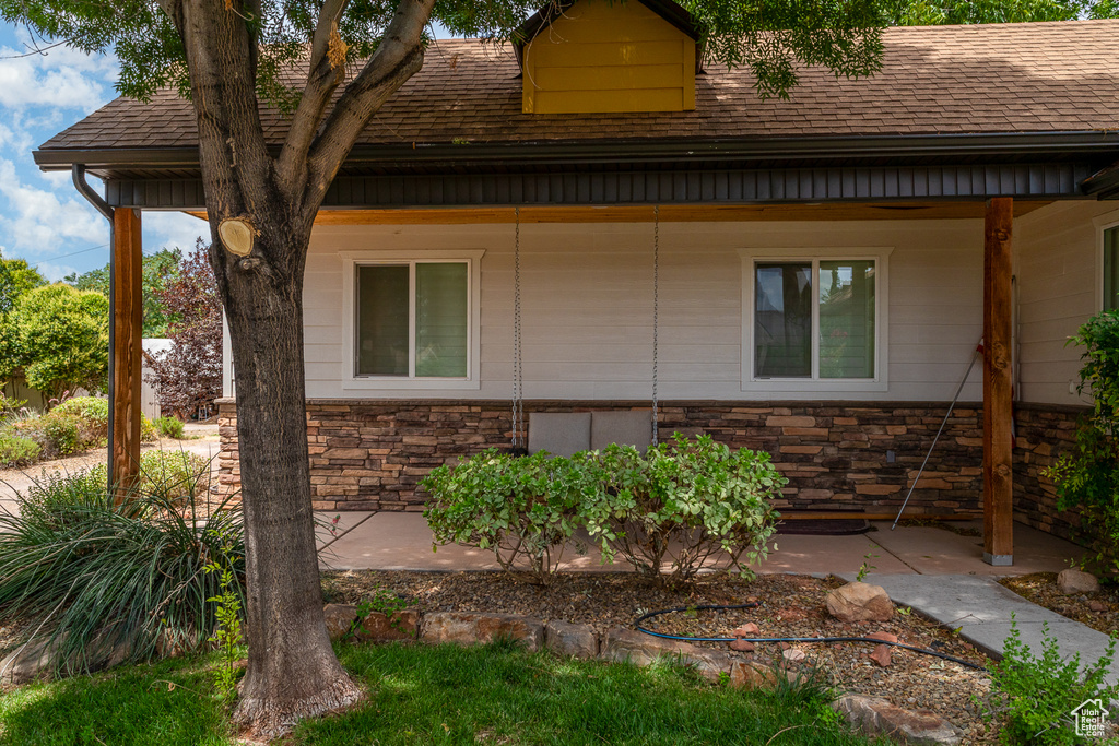 View of home\'s exterior featuring stone siding