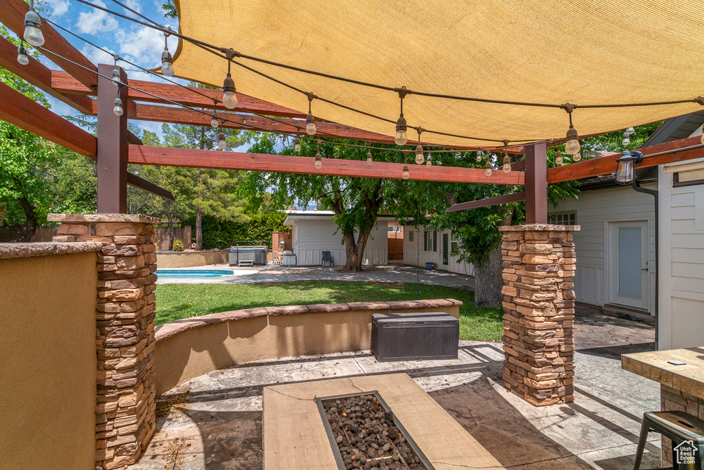 View of patio featuring a pool and a pergola