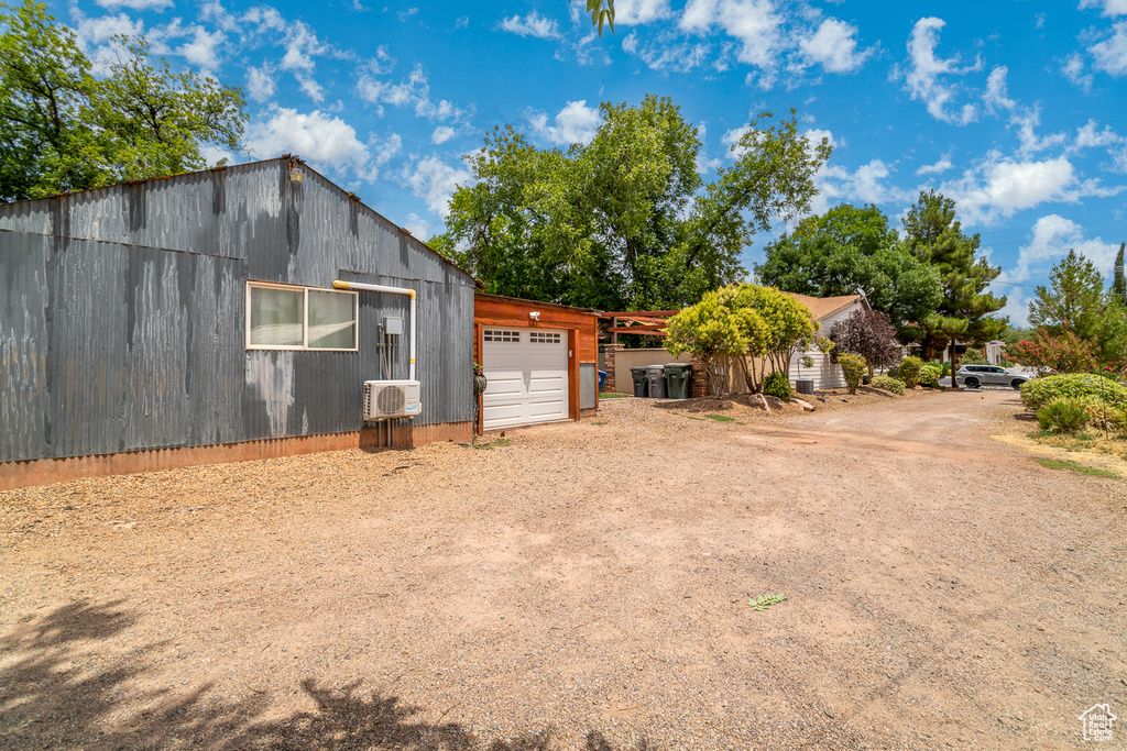 Exterior space featuring a garage and driveway
