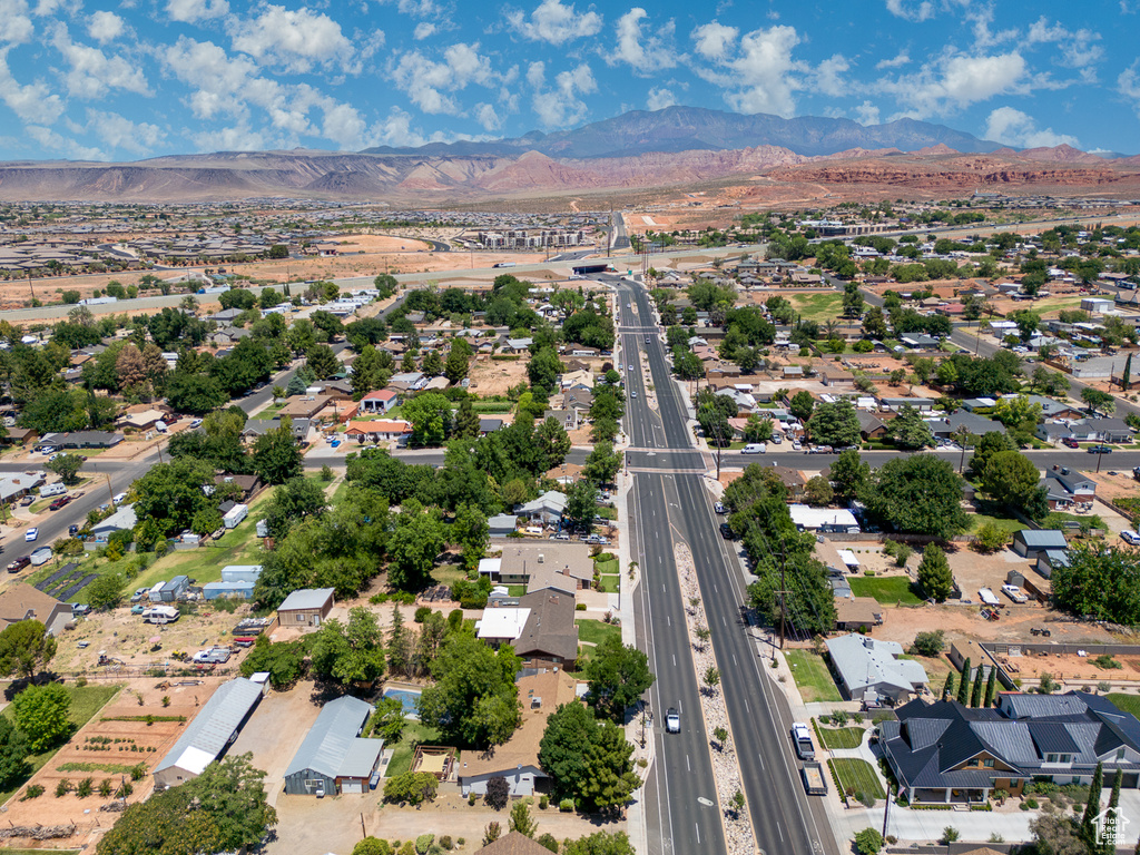 View of property location featuring a mountain backdrop and nearby suburban area