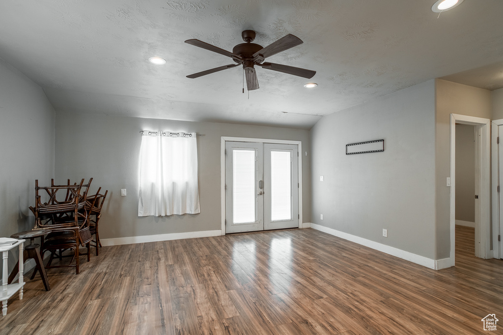Foyer with a ceiling fan, wood finished floors, recessed lighting, and french doors