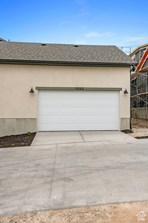 Garage featuring driveway