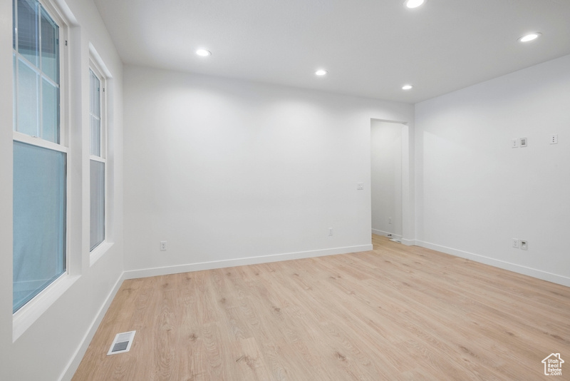 Spare room featuring recessed lighting and light wood-style flooring