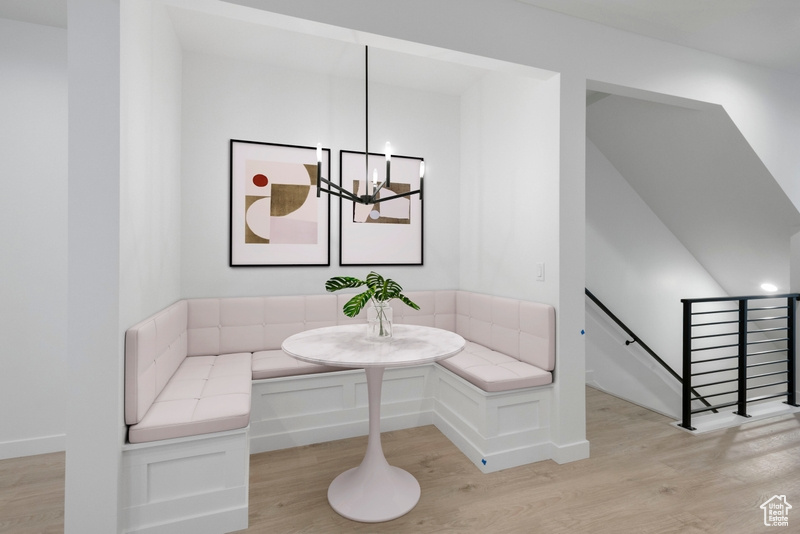 Dining space featuring breakfast area, light wood-style floors, a chandelier, and recessed lighting