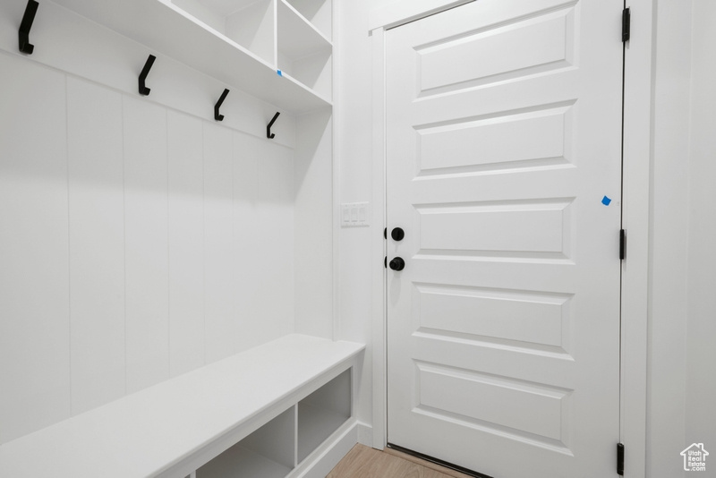 Mudroom with light wood finished floors