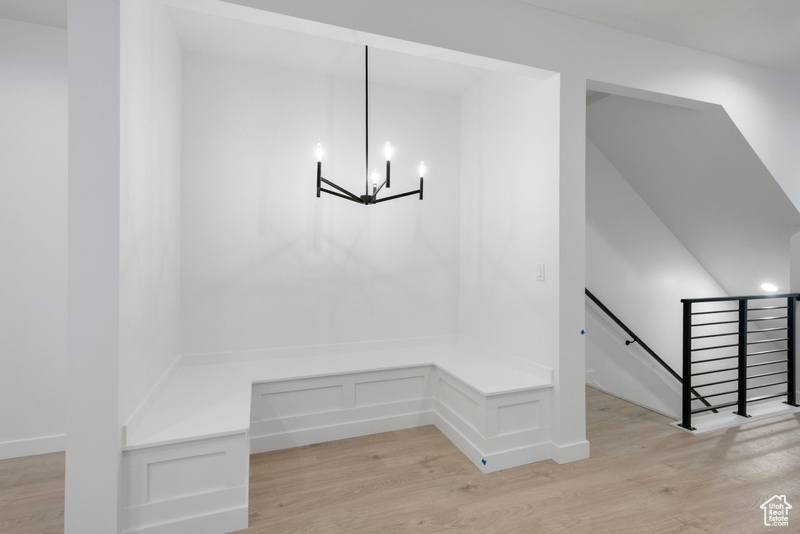 Mudroom with a chandelier, light wood-style flooring, and recessed lighting