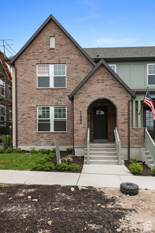 View of front of property featuring brick siding