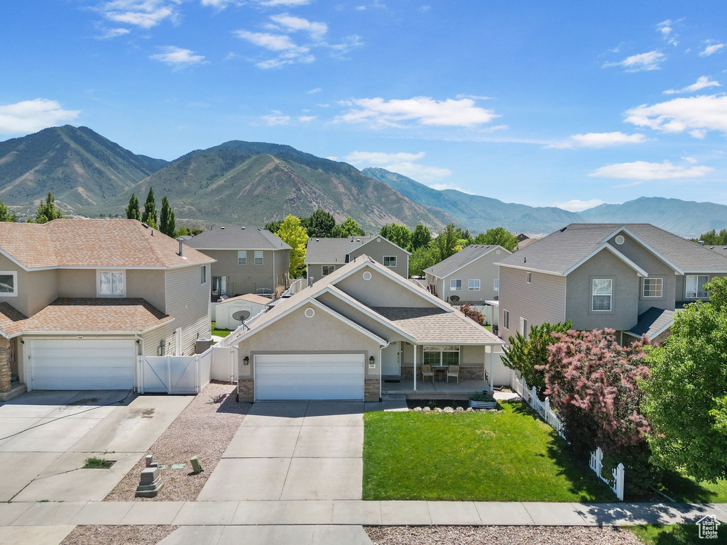 Traditional home with concrete driveway, a residential view, and a gate