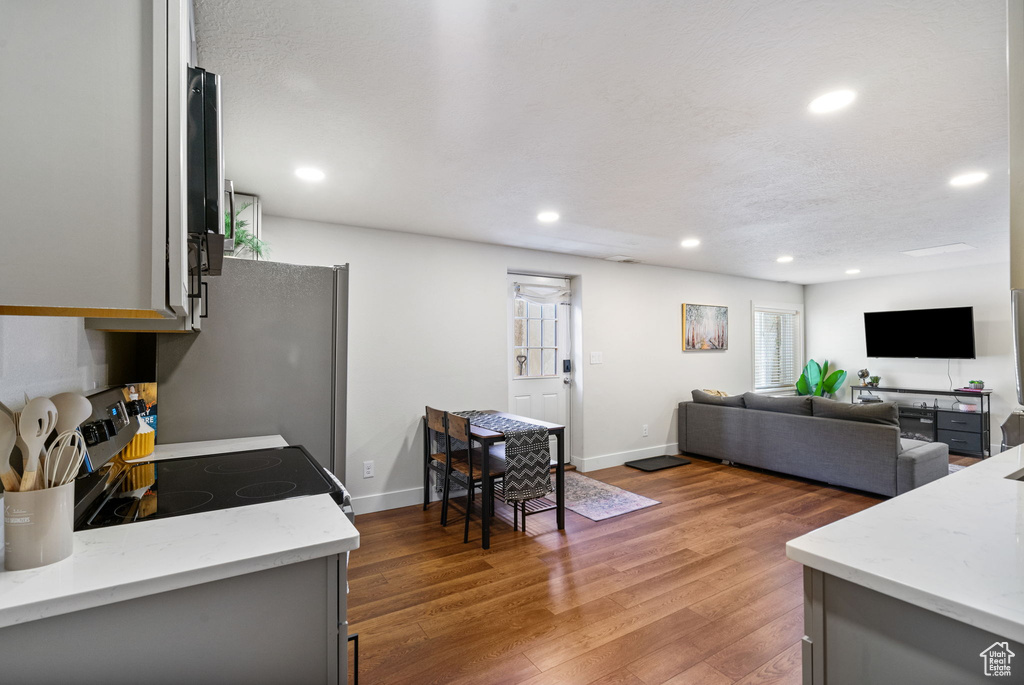 Living room featuring recessed lighting and light wood-style flooring