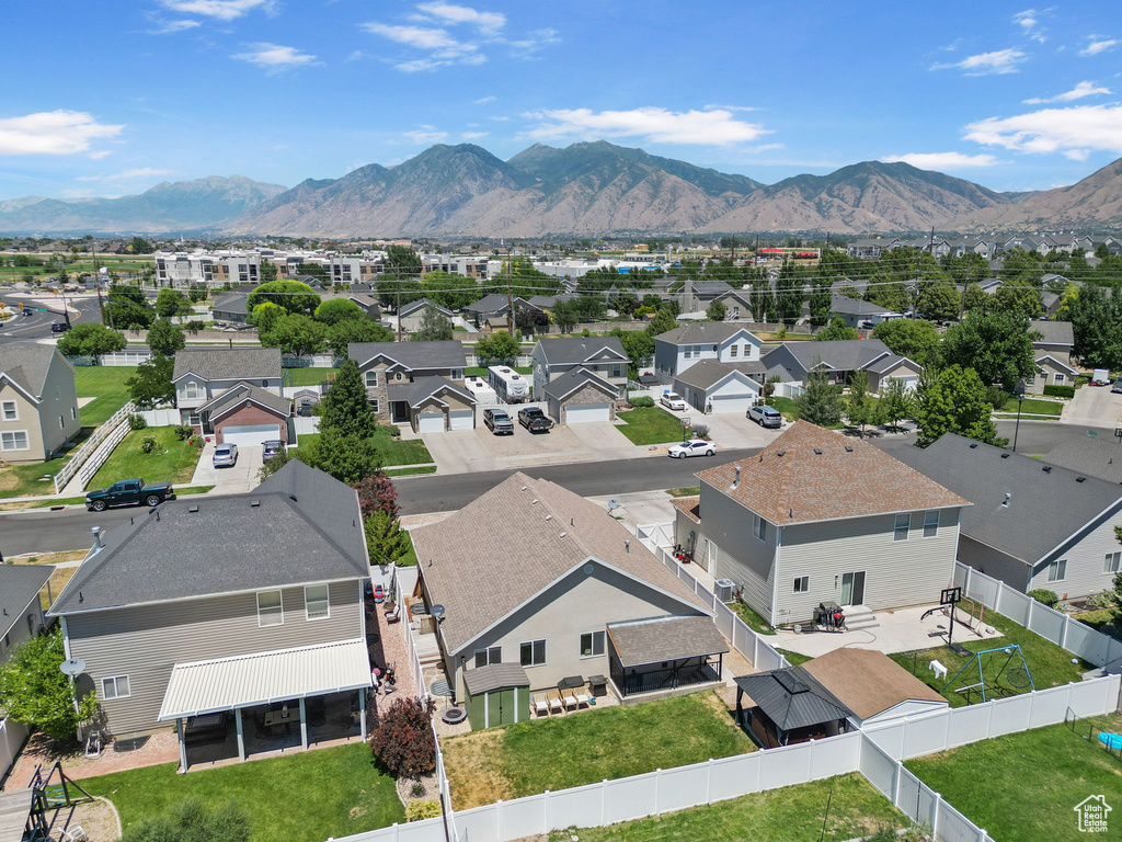 Aerial perspective of suburban area with a mountainous background