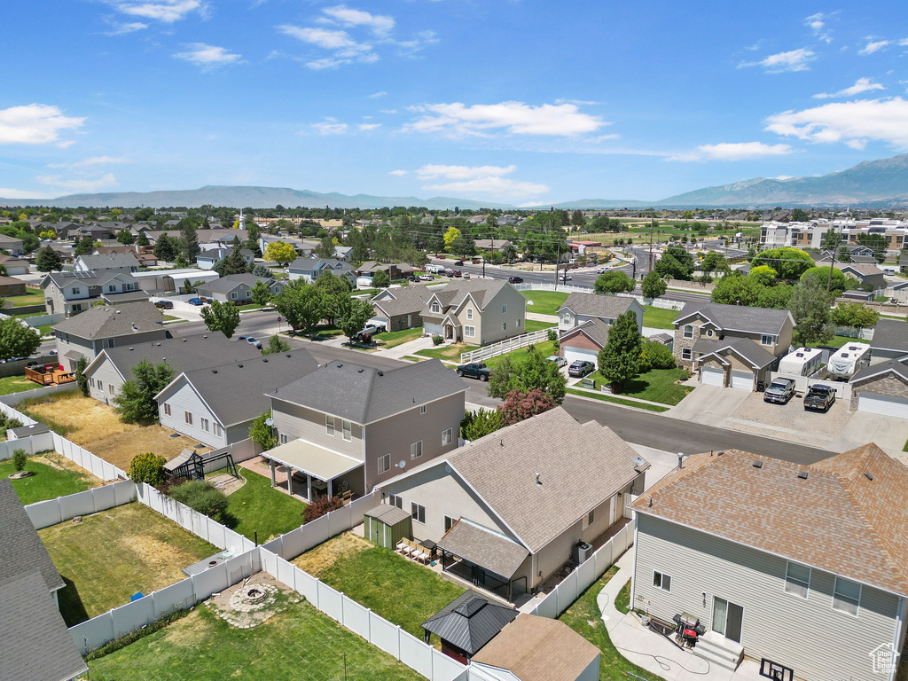 Aerial view of residential area featuring mountains