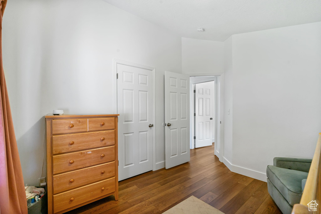 Sitting room featuring dark wood finished floors and baseboards