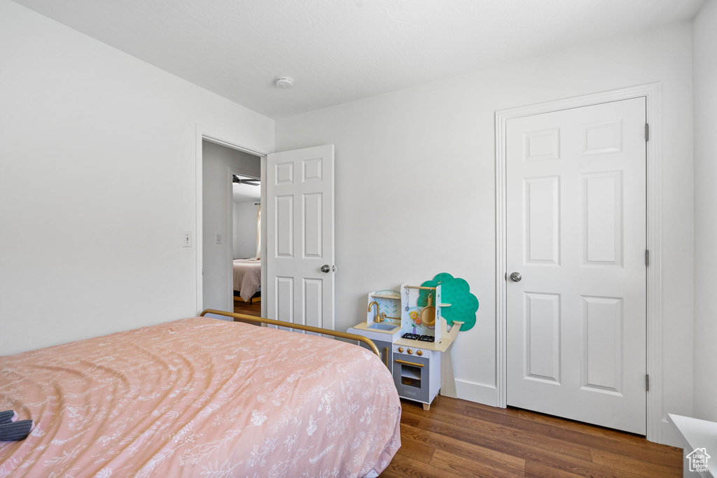 Bedroom featuring dark wood-type flooring