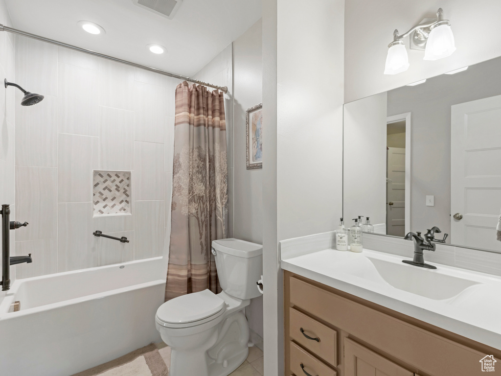Full bathroom with shower / bath combination with curtain, vanity, recessed lighting, and tile patterned floors
