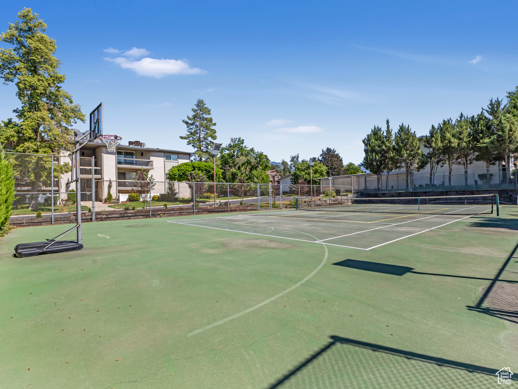 View of tennis court featuring community basketball court