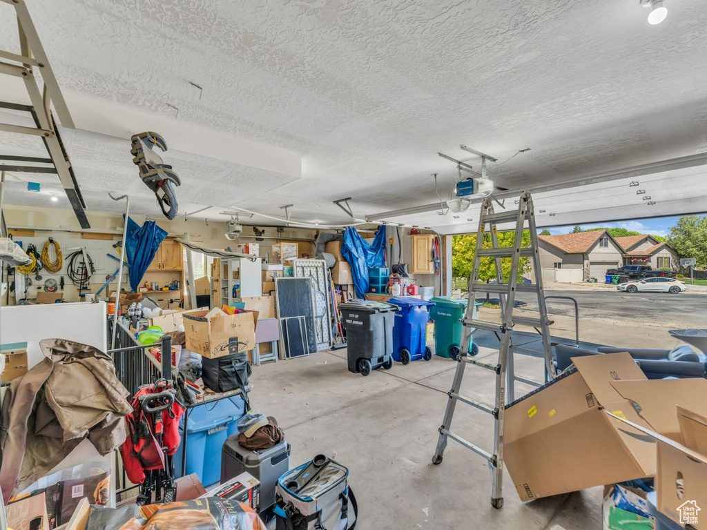 Garage featuring a garage door opener