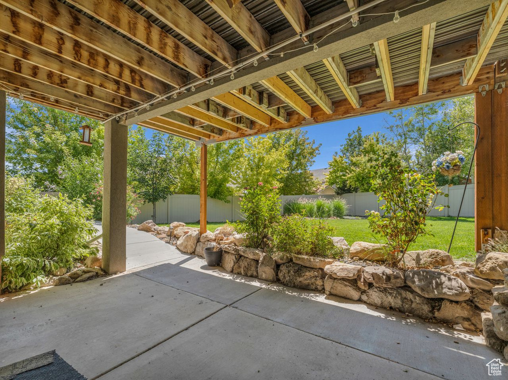Fenced backyard with a patio area