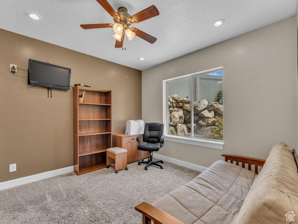 Office space featuring a ceiling fan, light carpet, a textured ceiling, and recessed lighting