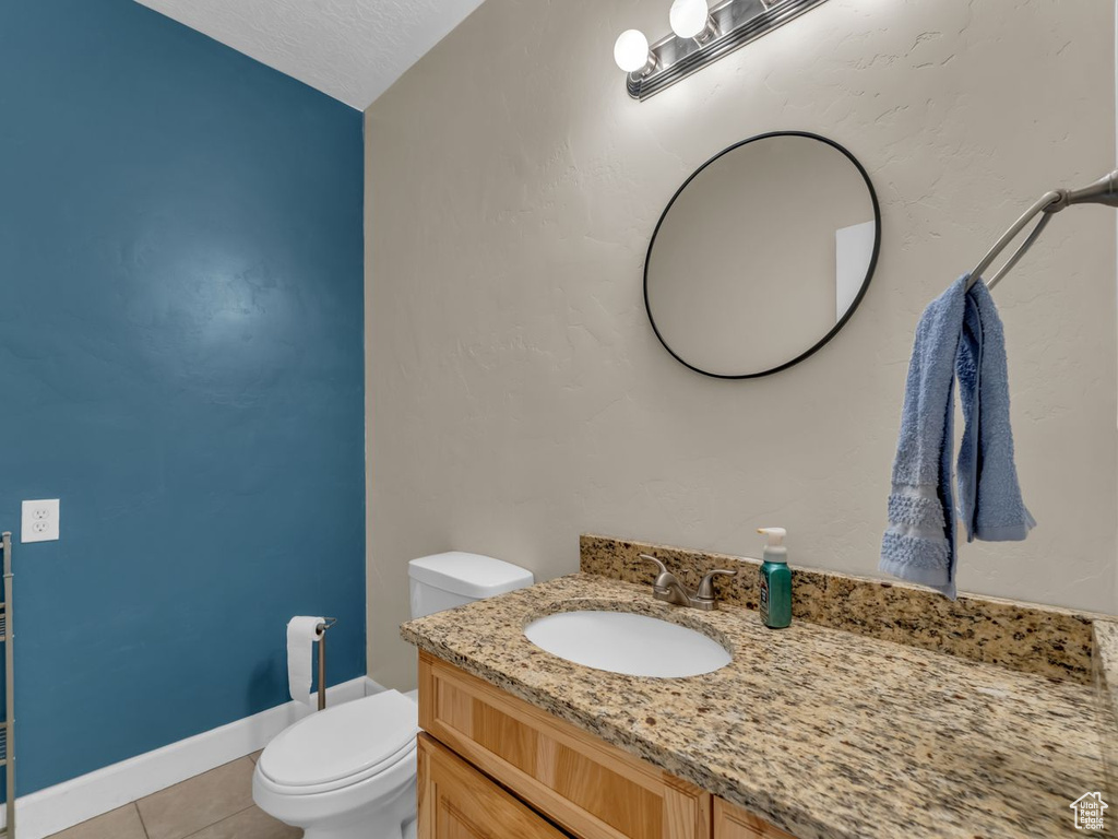 Bathroom with vanity and tile patterned floors