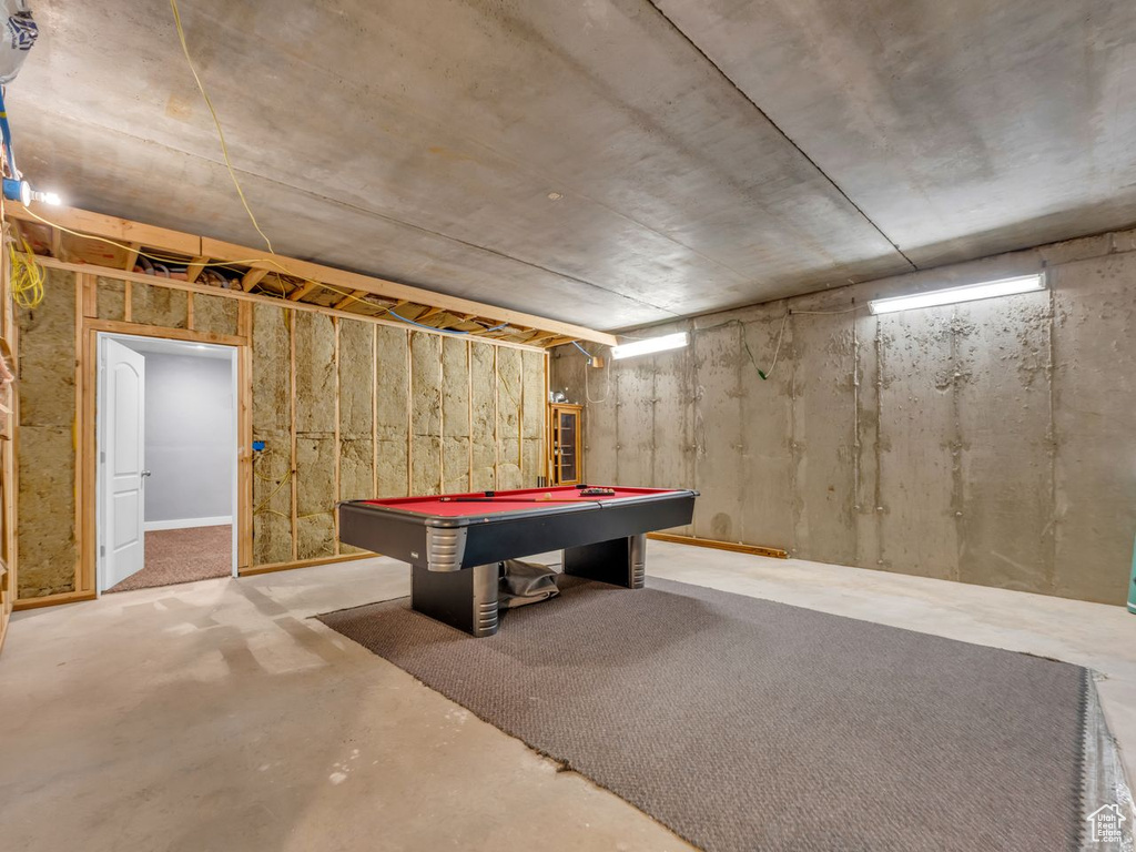 Rec room with finished concrete flooring and pool table