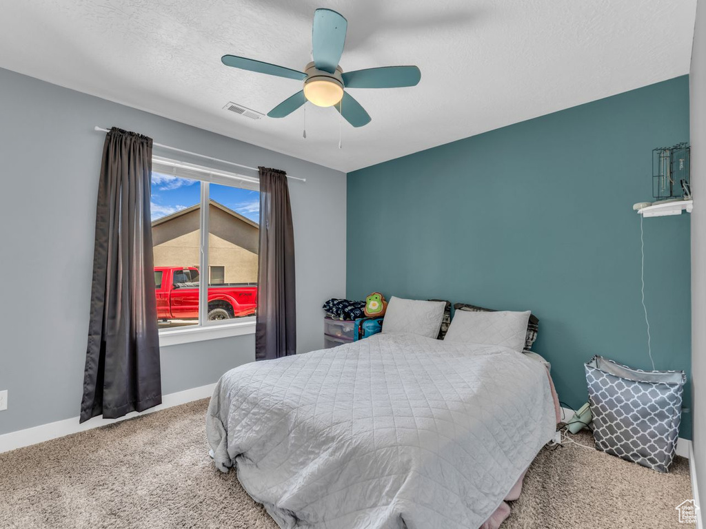 Bedroom featuring carpet flooring and a ceiling fan