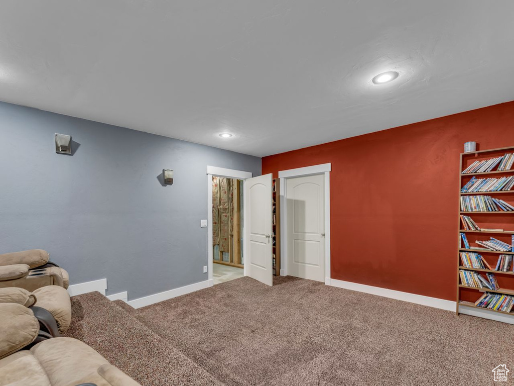 Cinema room with carpet and recessed lighting